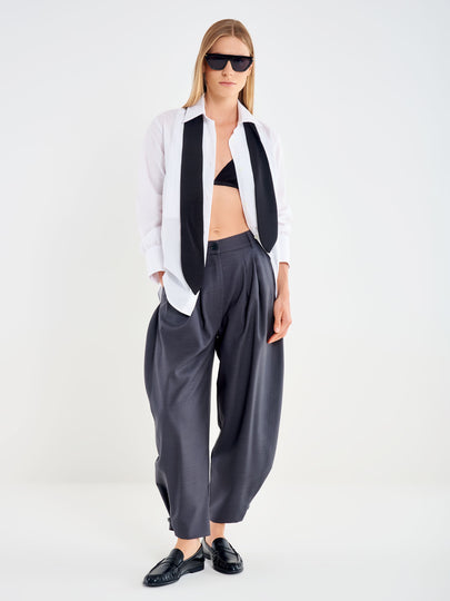 Trousers with a Button at the Hem