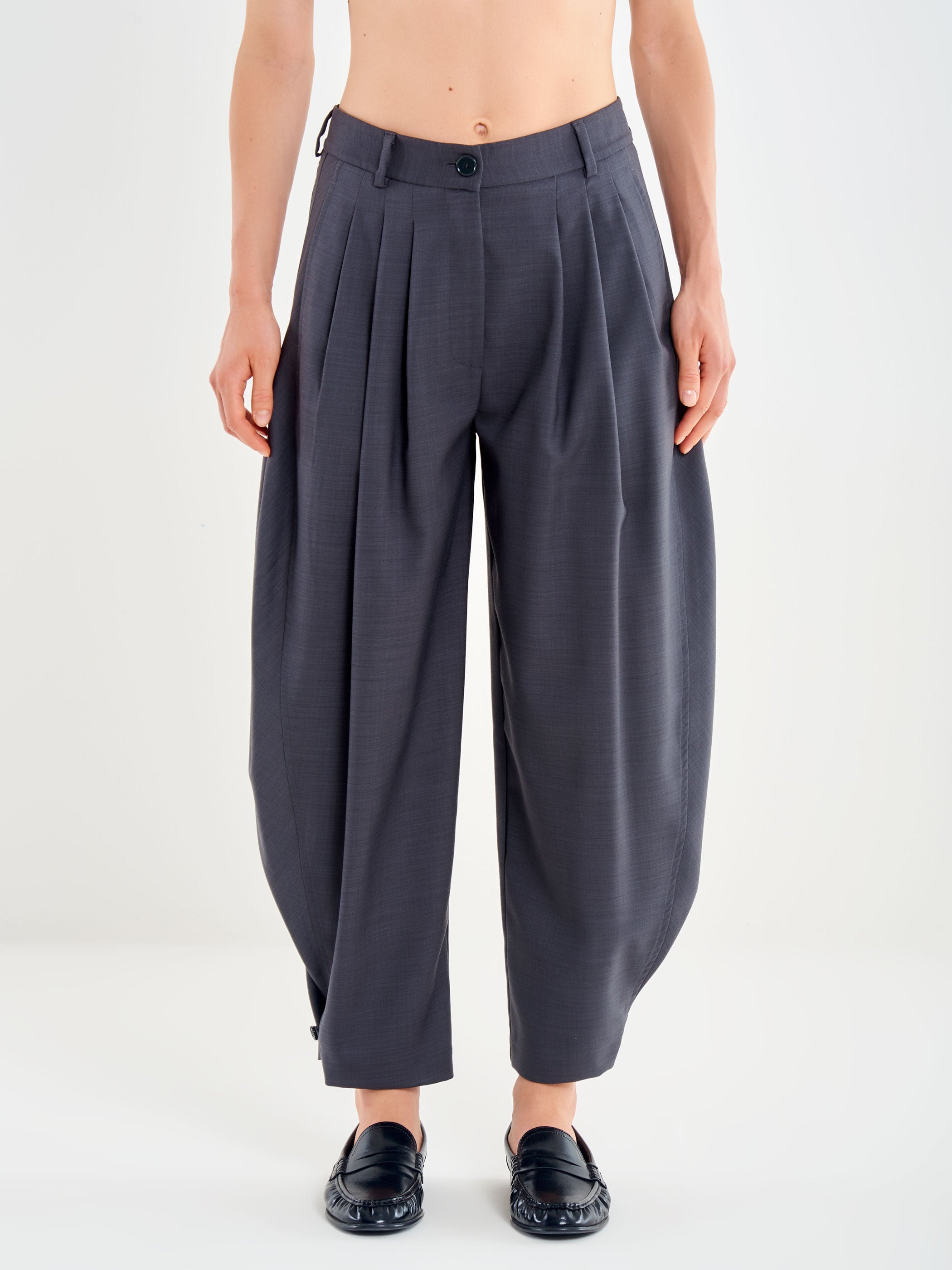 Trousers with a Button at the Hem