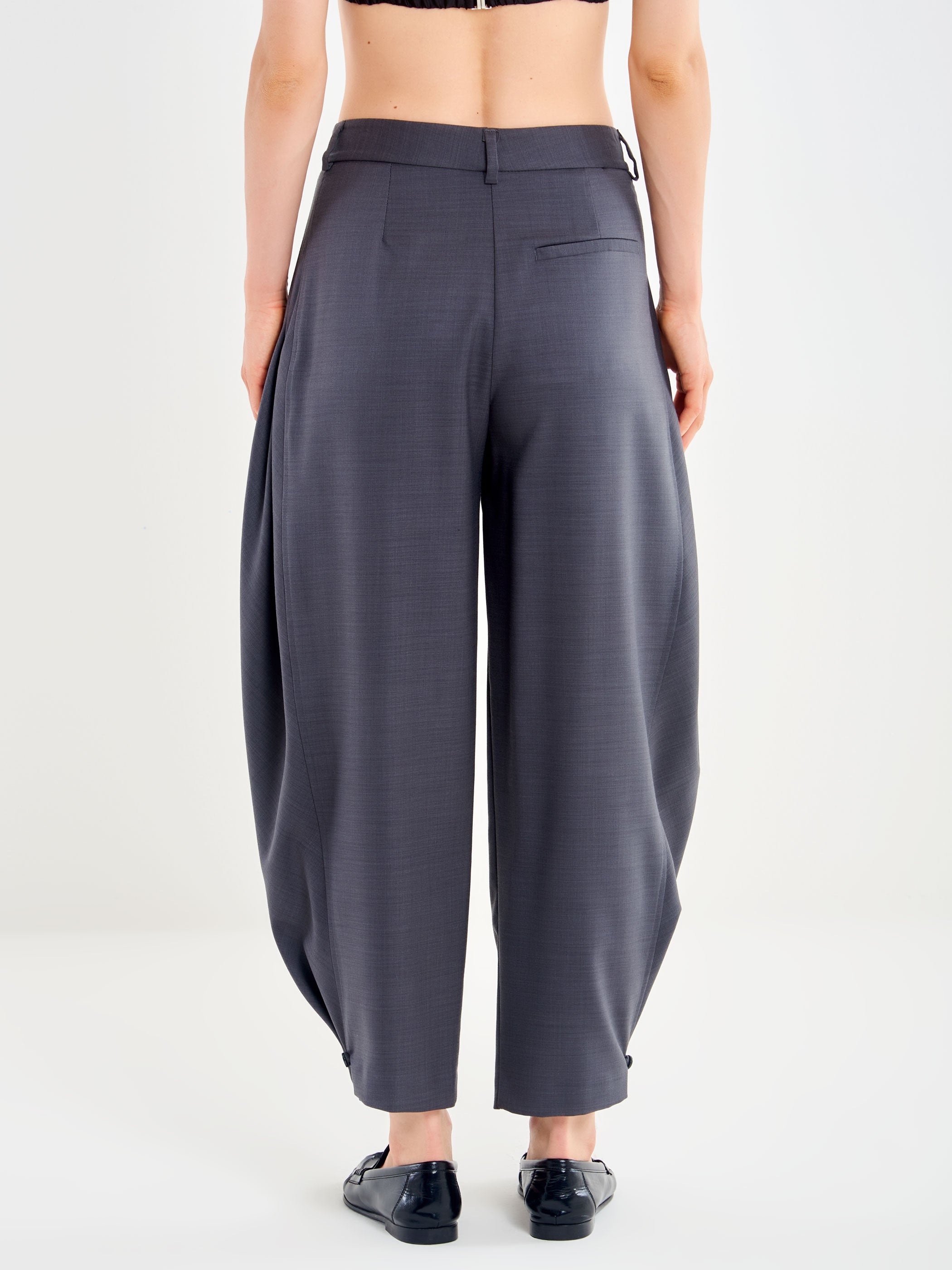 Trousers with a Button at the Hem